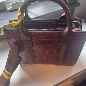 Wrangler tote bag. Brand new never used. Brown leather with strap.
